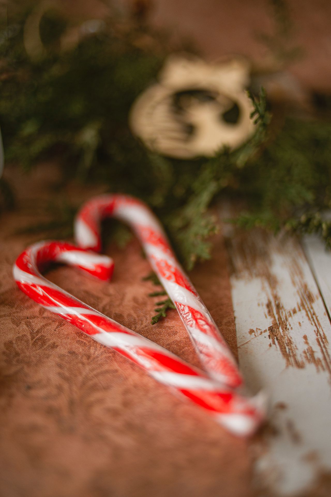 Candy Canes on a wooden table.