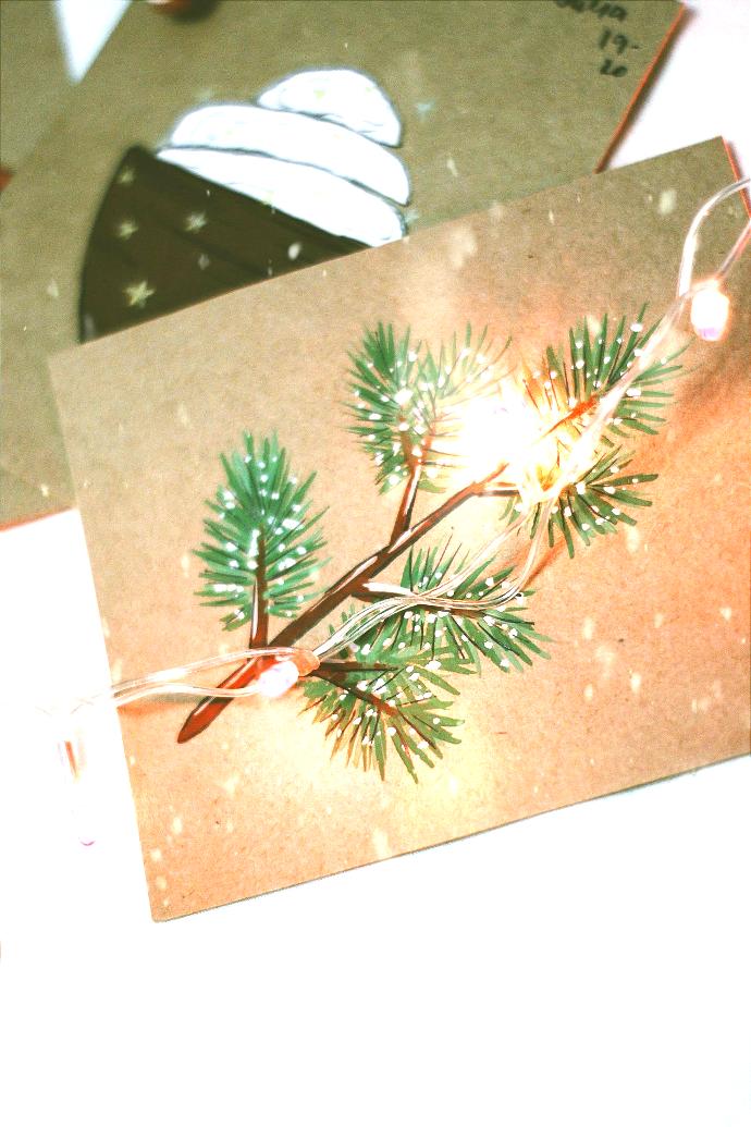 Holiday card with a tree branch on it.